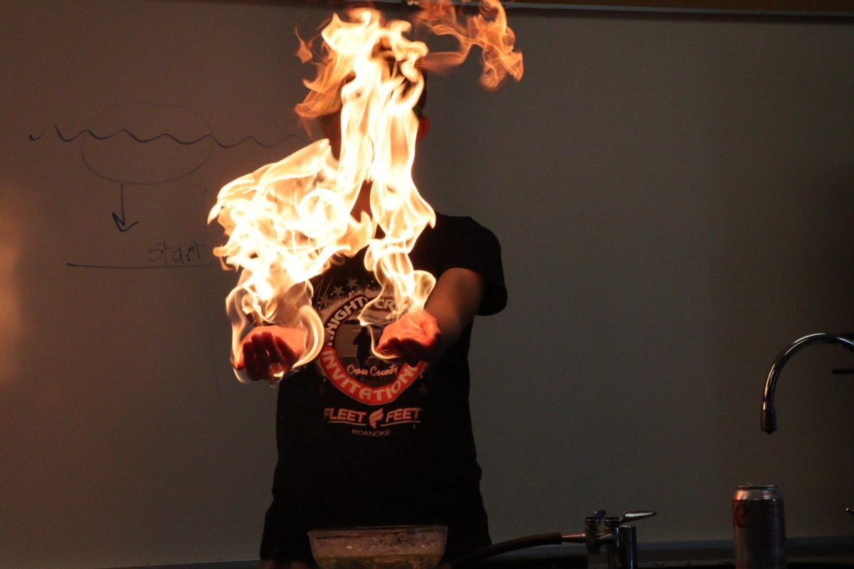 Dramatic fire bursting created out of Noah hands during the supervised science experiment to show how propane and fire works combined. "I was a little scared at first since I said yes to Ms.Smith on using both of my hands for the experiment." - Sophomore Noah