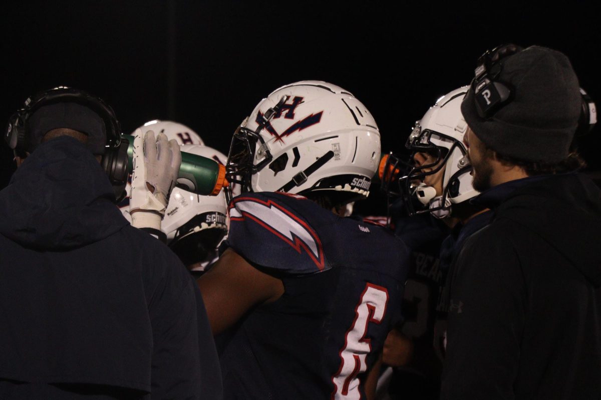 Senior Joel Friebe-Makinto drinks water during a timeout.