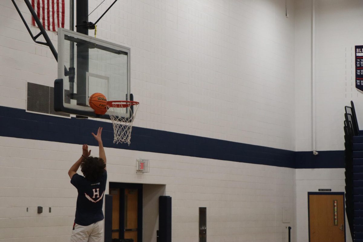 Junior Kiril Zulfikarov shooting the ball at practice. 