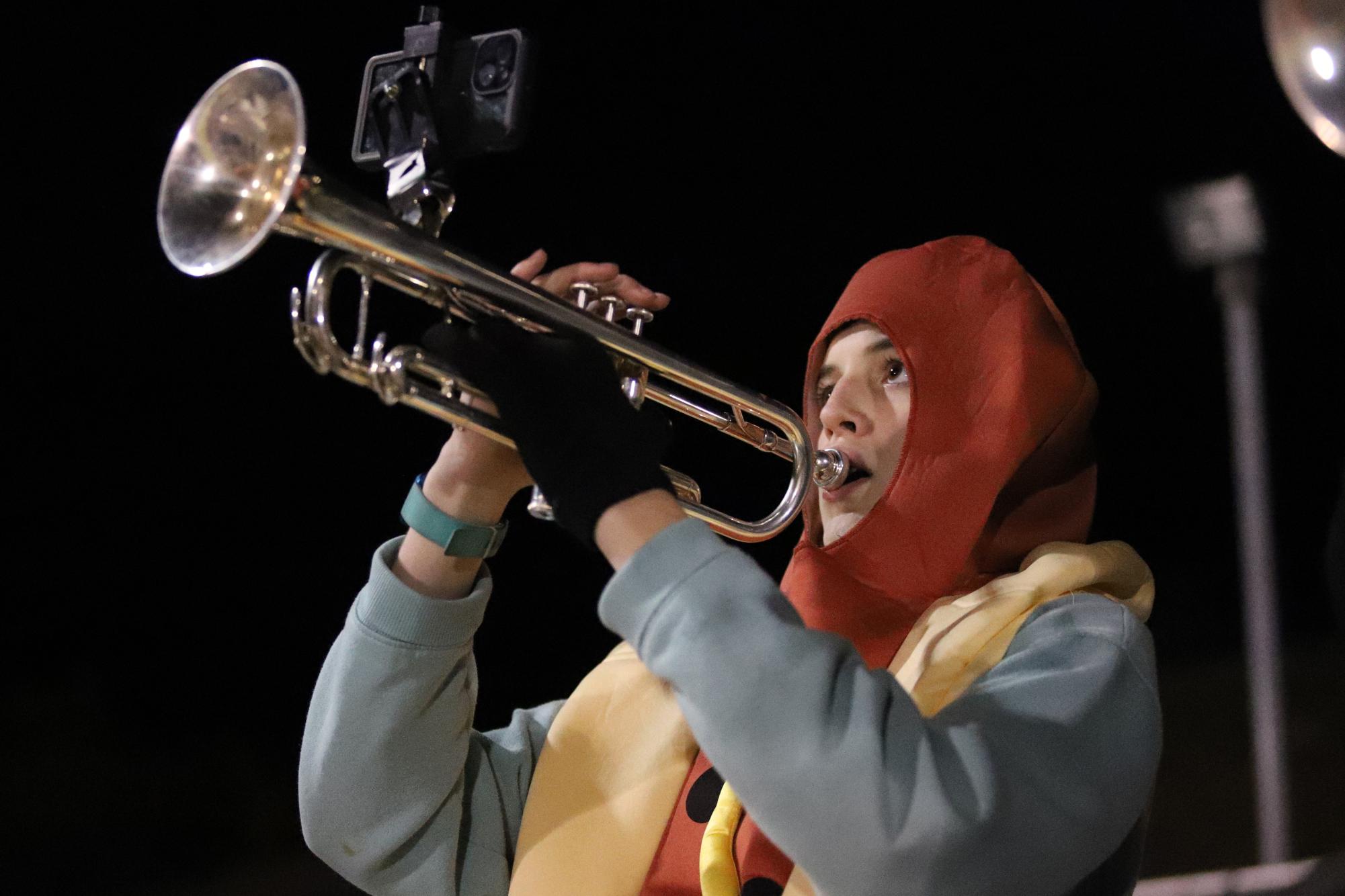 Freshman Tucker Svatko plays his trumpet.