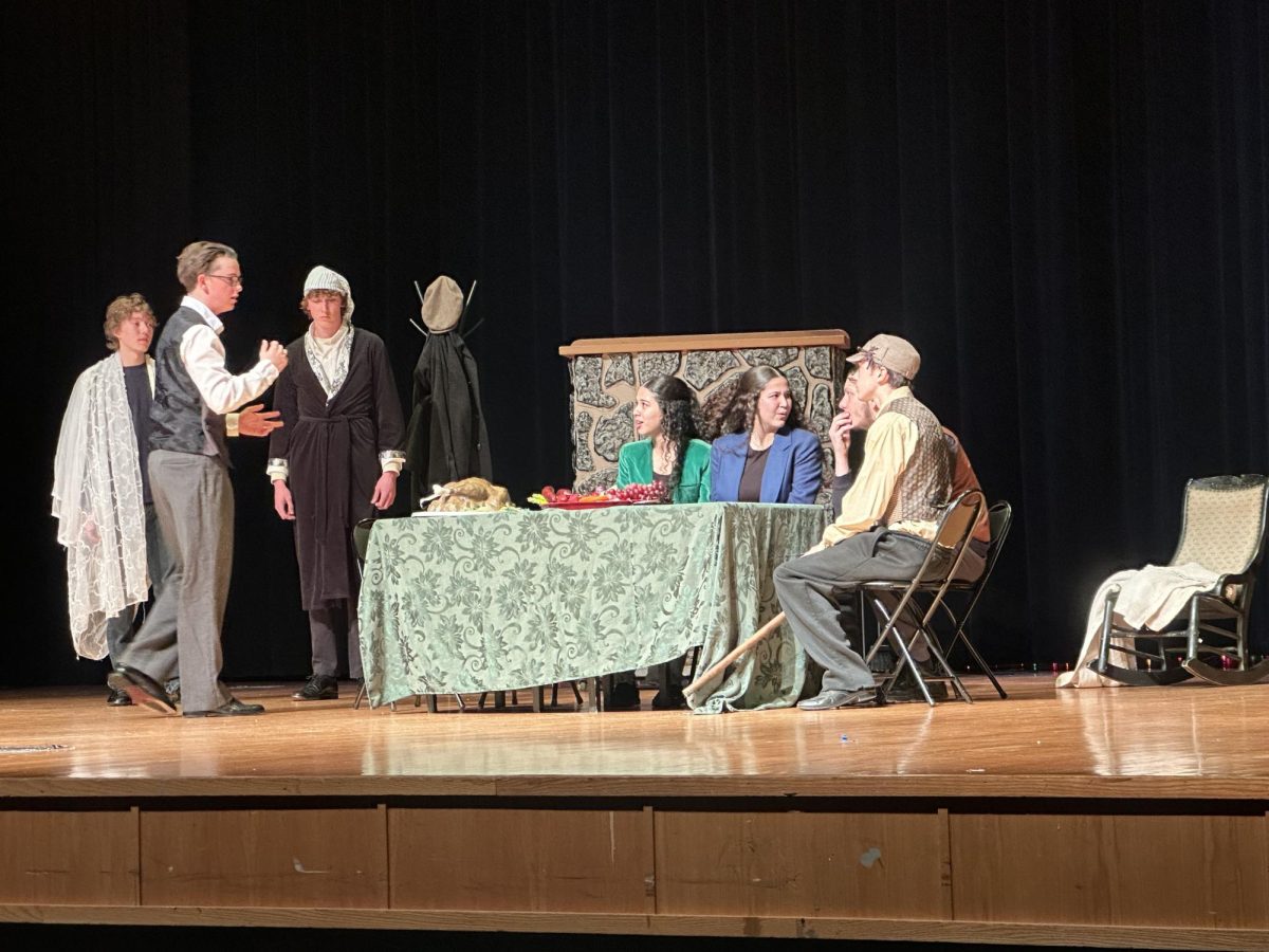 The actors sit at the table and discuss what is happening to the old man of the play. "When we were talking all of us at the table was one of my most important lines"- Sophmore Ariana Valderamos.