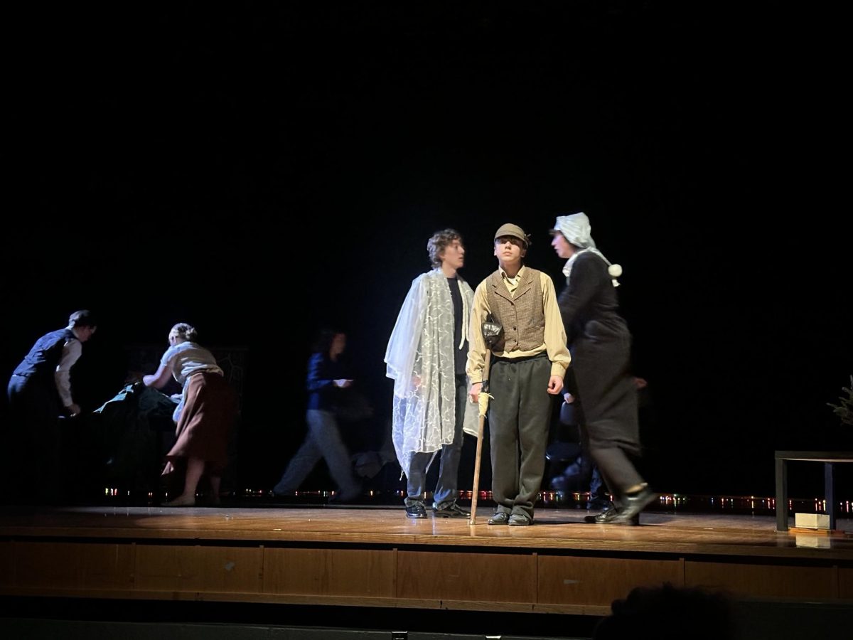 The actors walk onto the stage together to begin the scene. "You have to pay close attention to understand the play"- Senior Ollie Beach