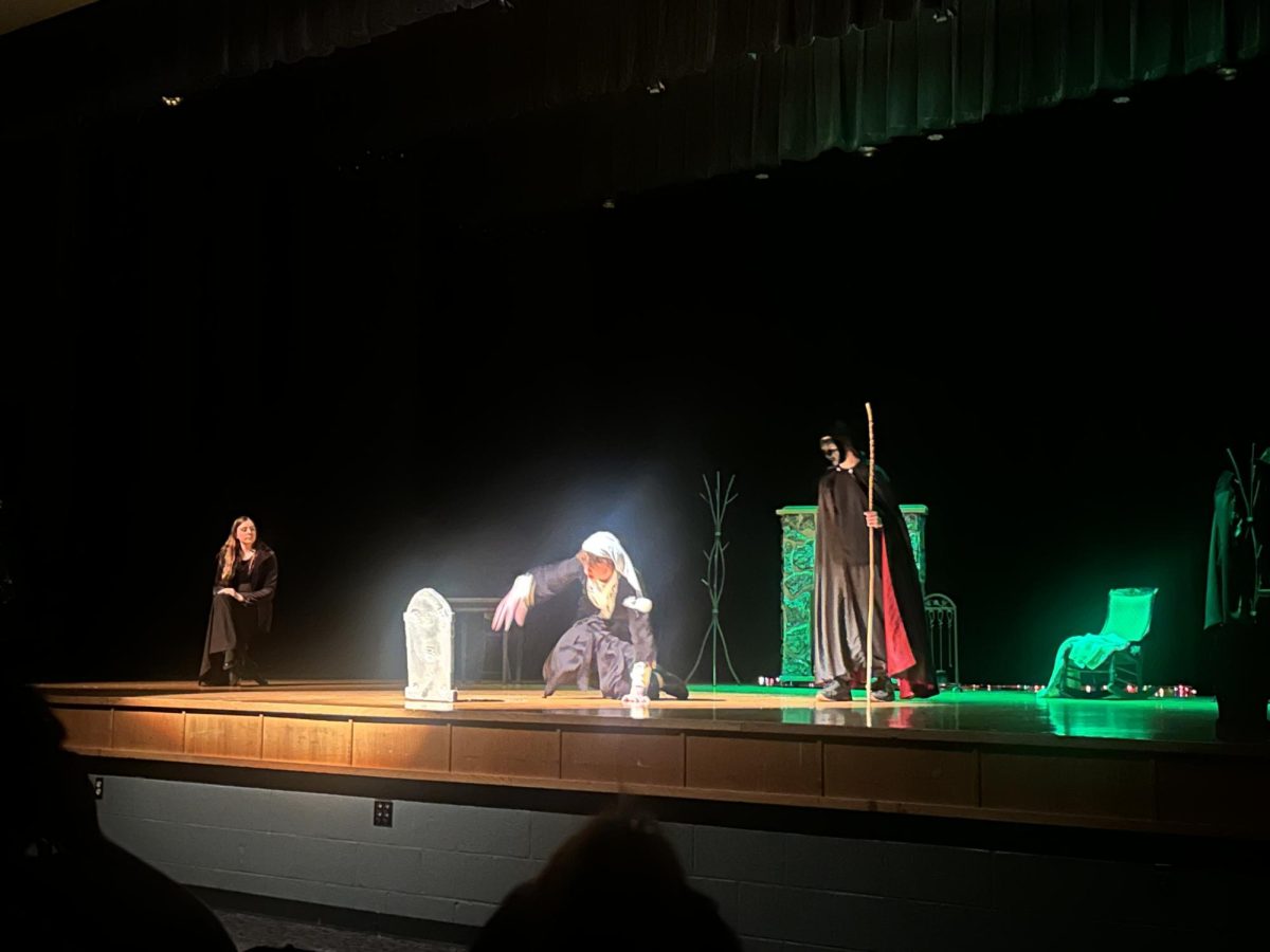 One of the actors stands alone under the spotlight because they wanted to finally be free. "This was one of the best parts because this is when the old man from the plays life was going to change."- Sophomore Ariana Valderamos