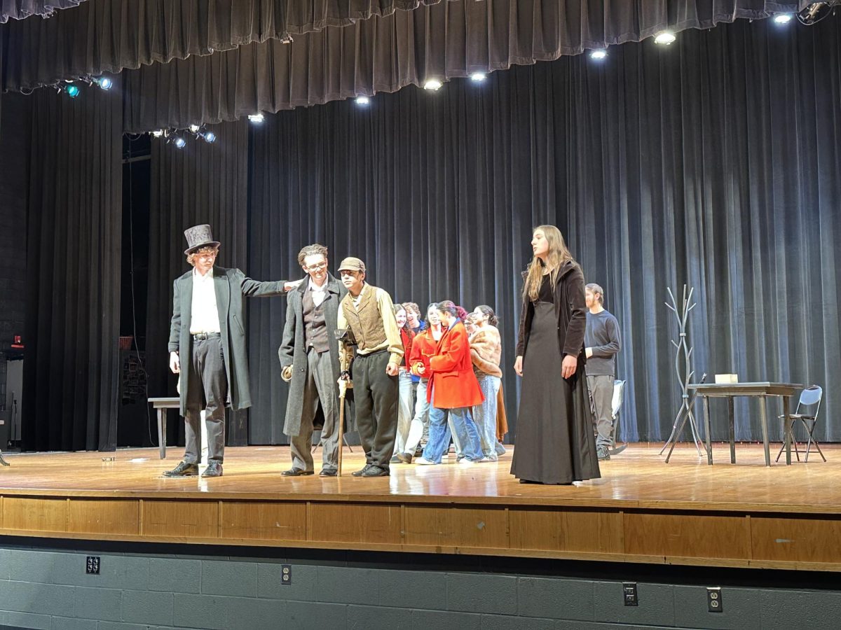 Actors come together as the story reaches a dramatic turning point. -"This scene was near the end of the act which gave the cast an happy ending"-Freshmen Talia Robles 