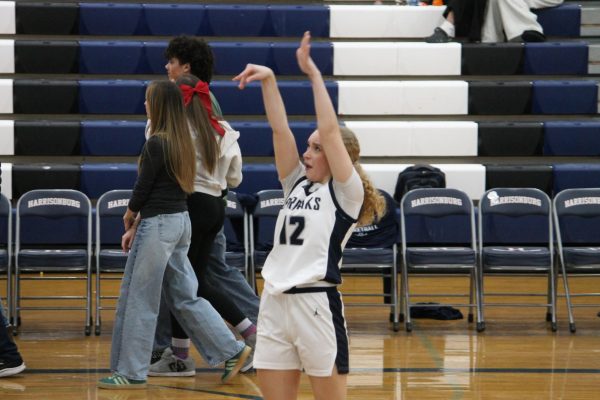 Sophomore Leah Crawford, warms up pregame.