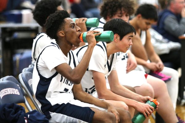Ngeleka drinks water on the bench.