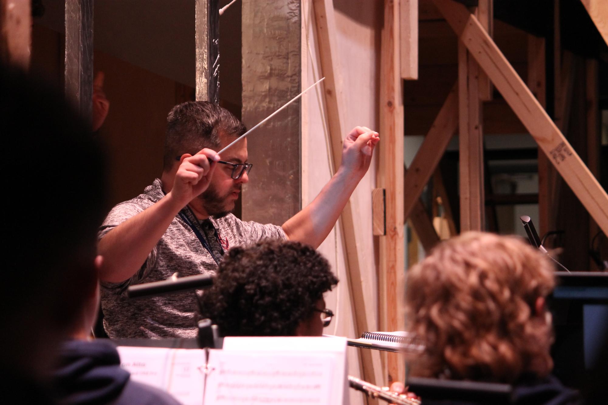 Daniel Upton queues an instrument during a song.