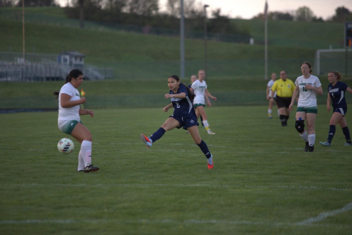 Gretel Lemus Cardenas kicks the ball to make a goal. 