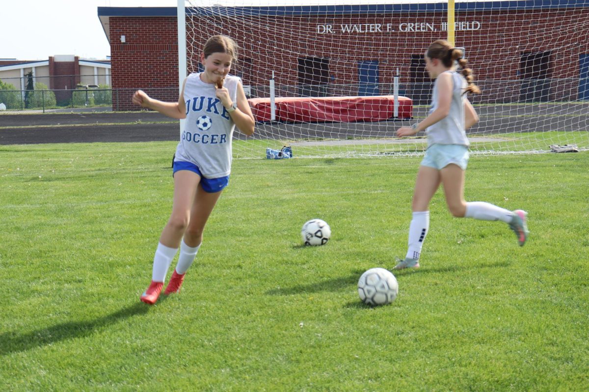 Players practice dribbling drills to improve control and footwork during their soccer practice. ¨ These drills help me get better at controlling the ball in games ¨ 8th grader Suzie Holsopple said.