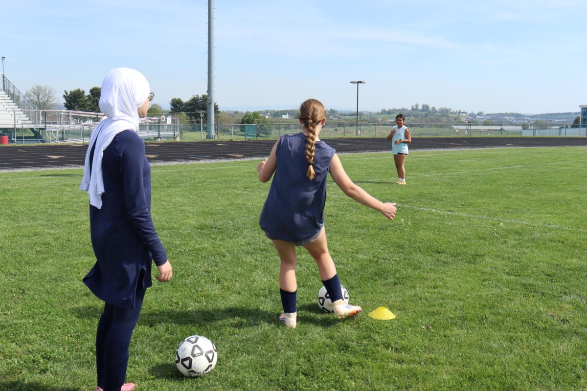 Sophomore Gabriela Bustamante works through cone drills to build speed, control, and coordination. " The cone drills are hard, but they make me faster and more focused." Sophome Gabriela Bustamante said.