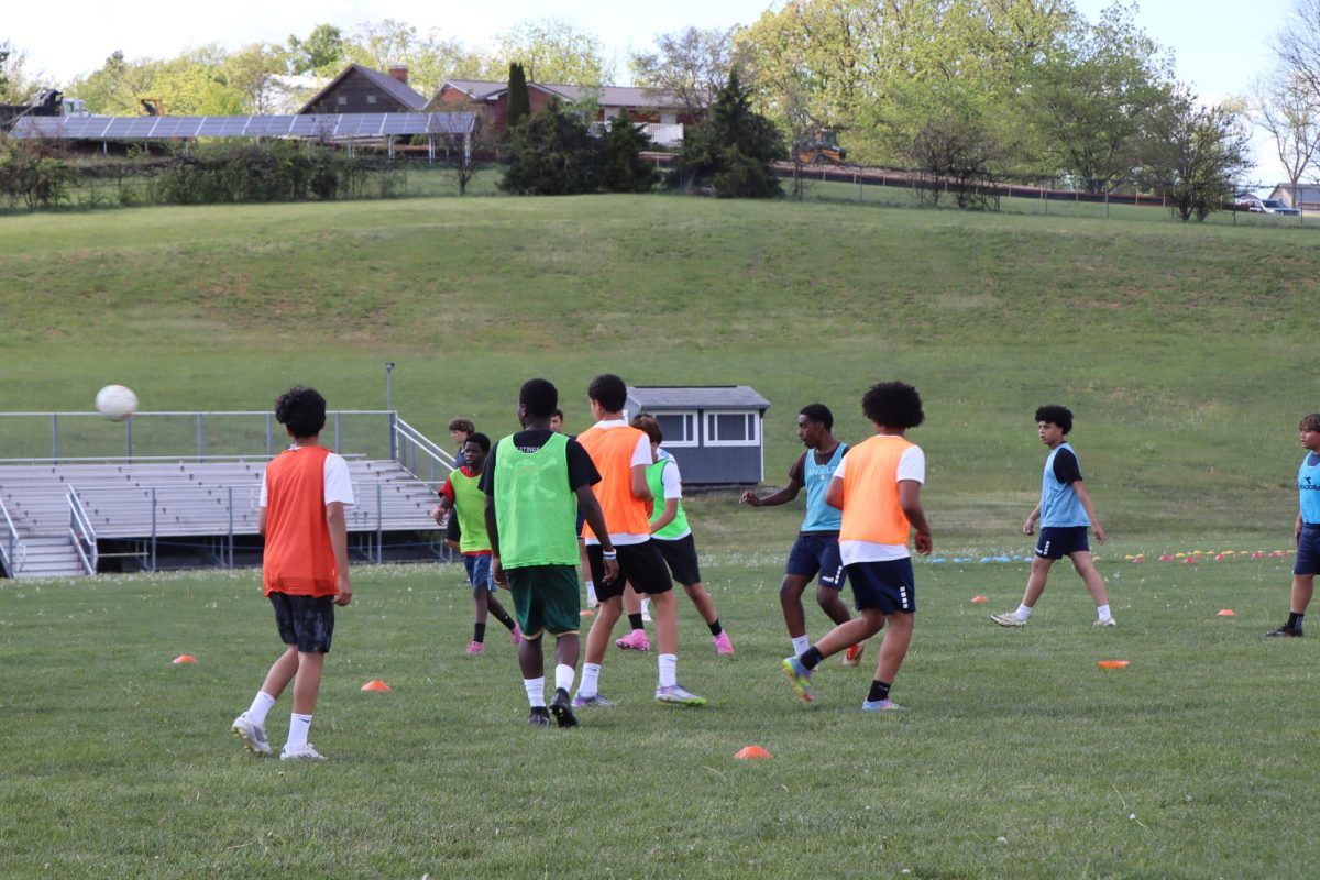 The team runs a group drill applying misdirection and defensive skills in a game like situation. "These drills help us get better for real games" Freshmen Joel Metzler's