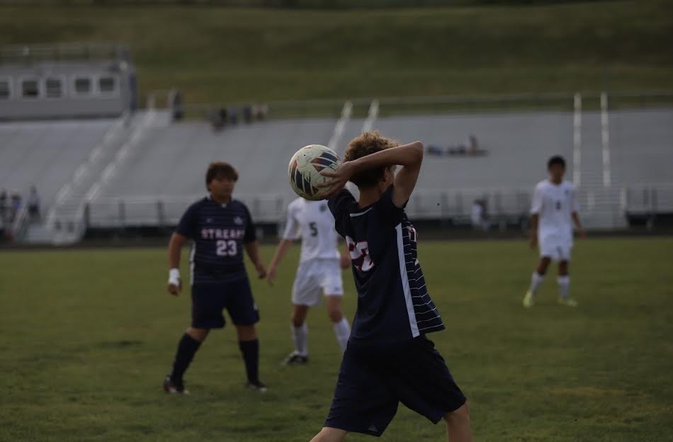 Eighth Grader Arrington Fornadel putting the ball back into play.