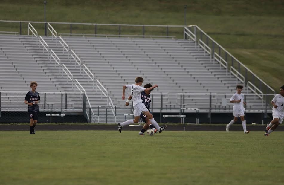 Freshman Alan Rios getting the ball before the other team.