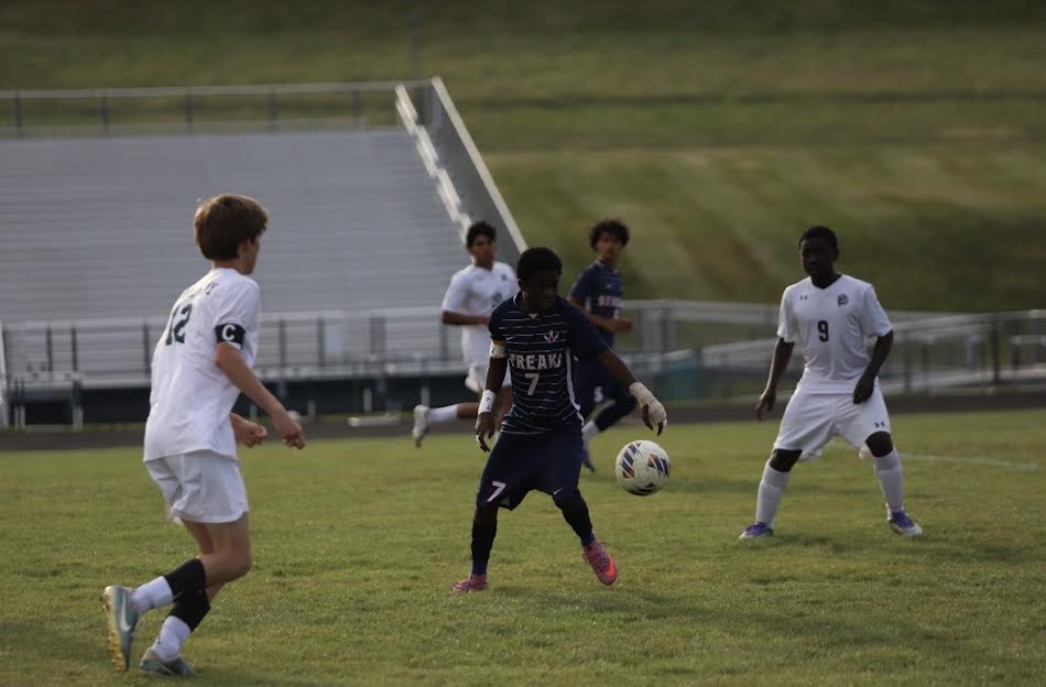 Freshmen Agustin Kalenga getting the ball.