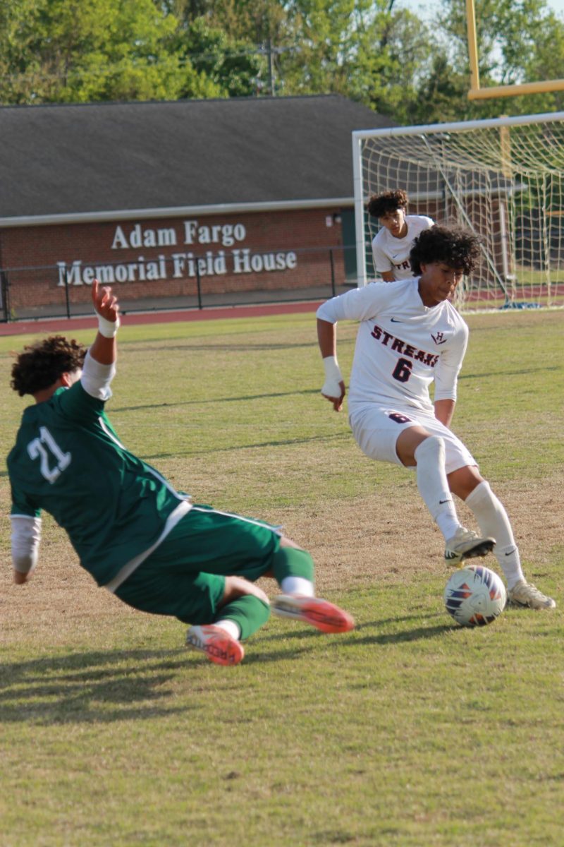 Freshman Michael Hernandez Castro jukeing a William Monroe deffender.