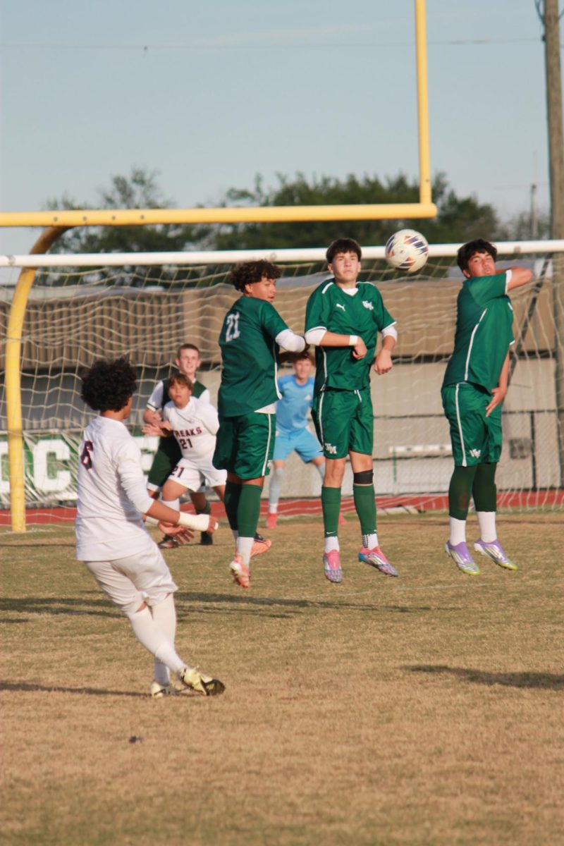 Freshman Michael Hernandez Castro taking a freecick and perfectly placing it in betweeen the wall of players.