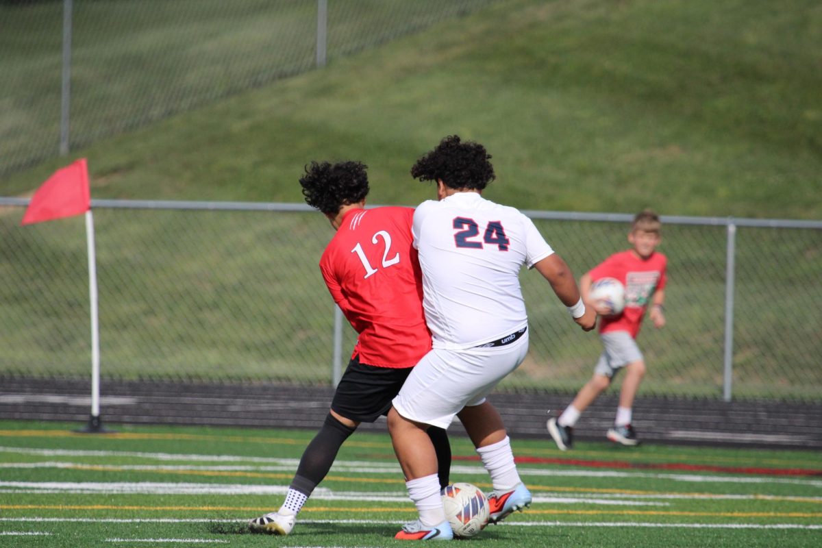 Freshman Alan Rios fighting fir the ball.