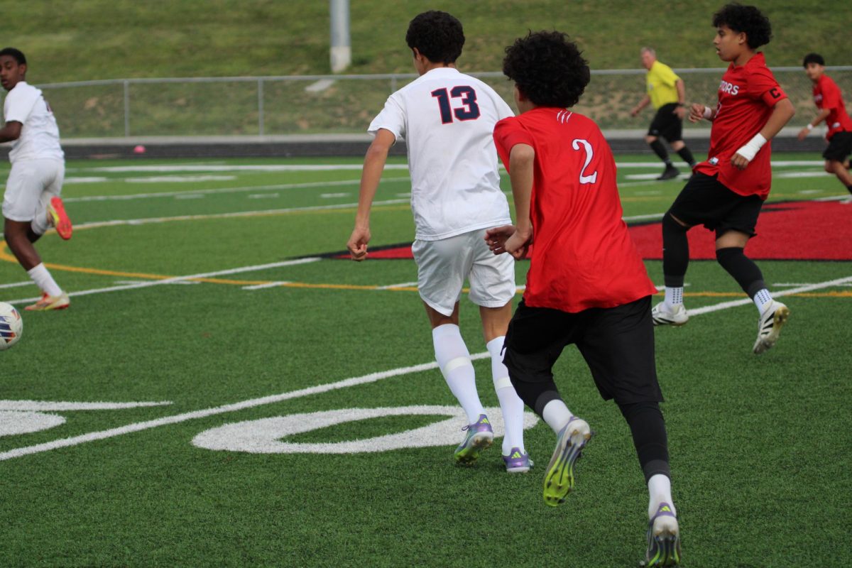 Freshmand Joel Metzler running to a ball passed to him.