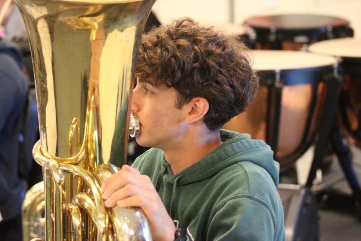 Freshman Kyle Rush plays his Tuba