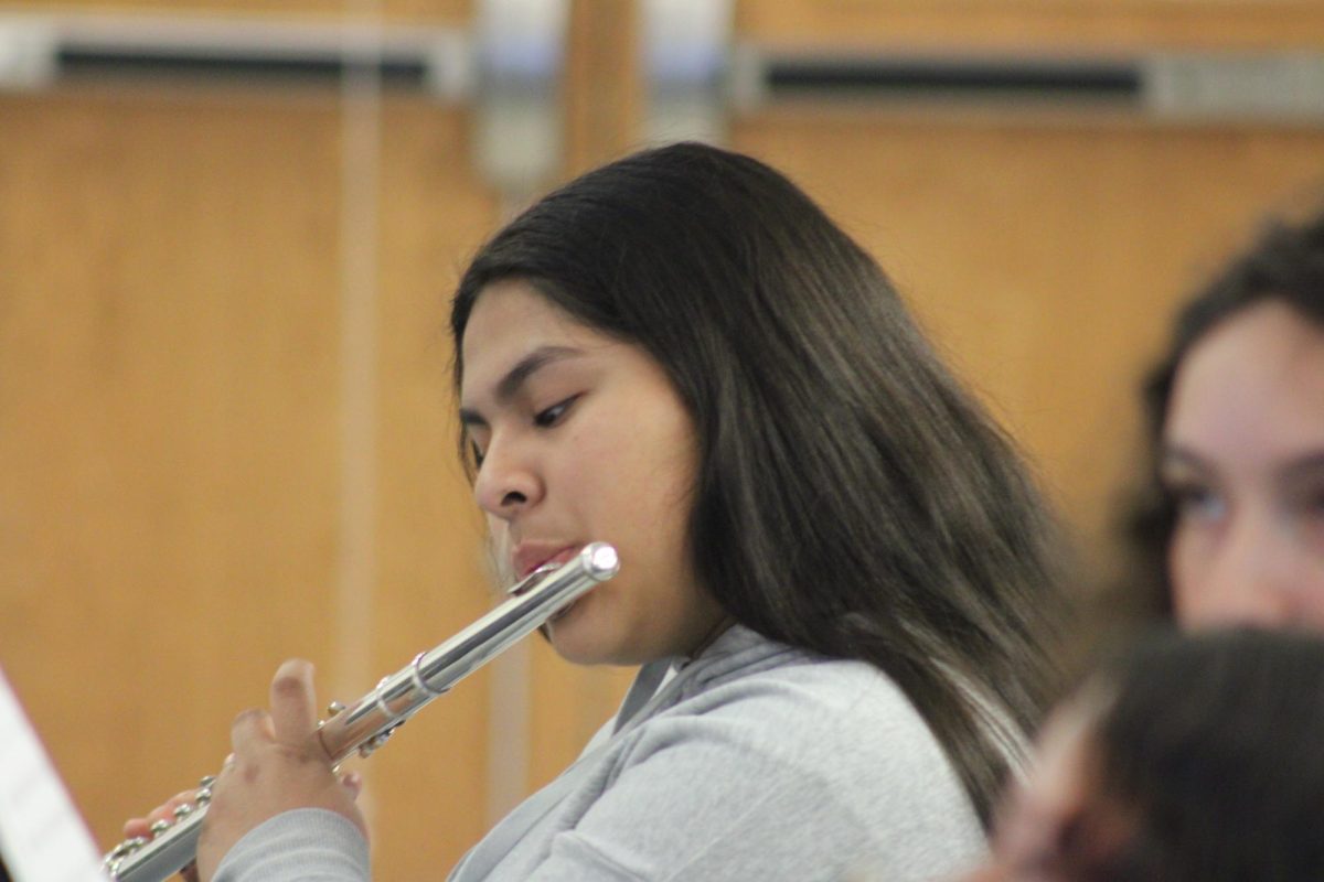Freshman Jamilet Hernandez reads her flute music.