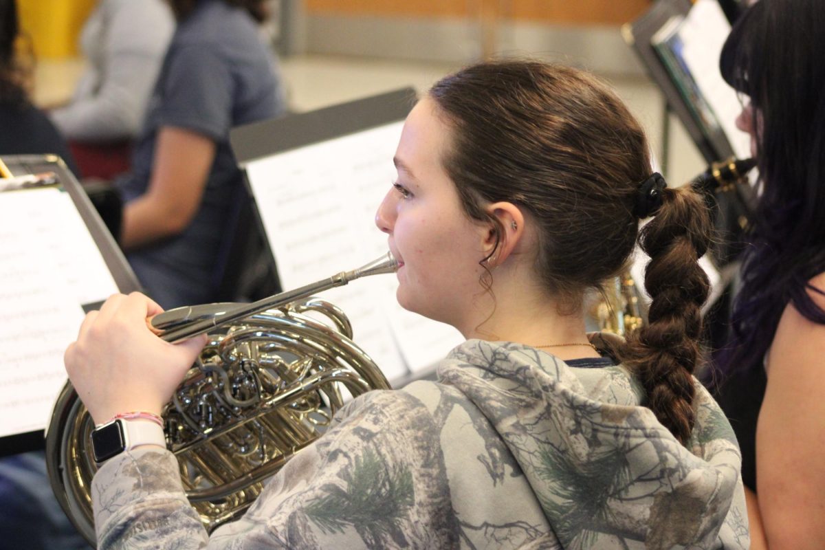Freshman Lael Wickline reads French horn music.